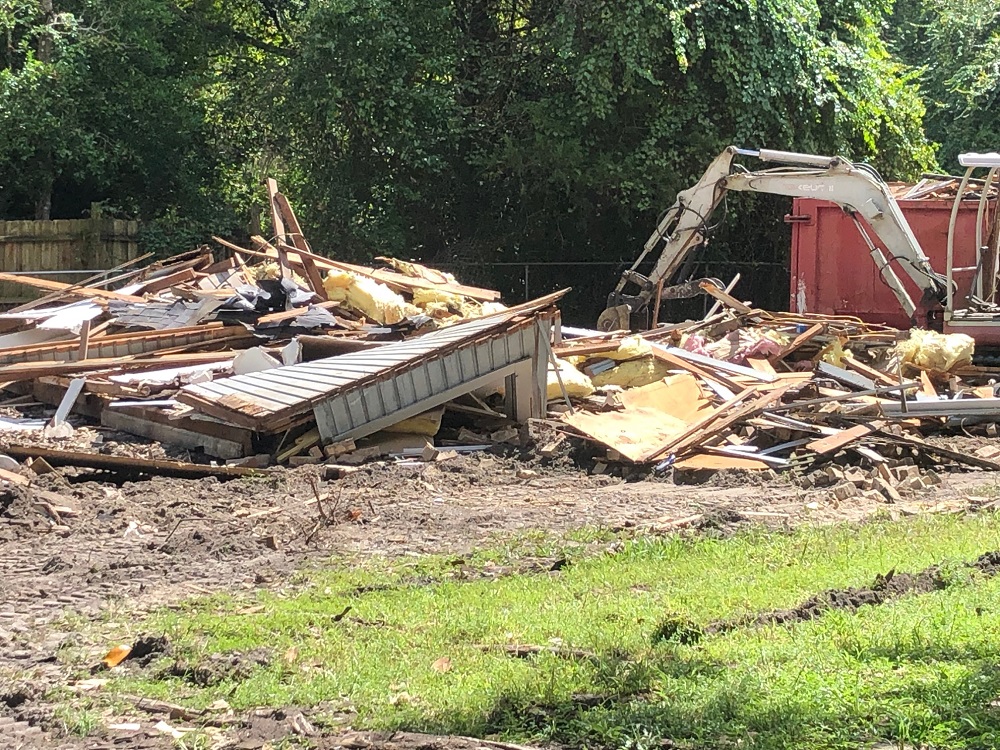 Start loading debri in rolloff dumpster on State Road 100 in Keystone Heights